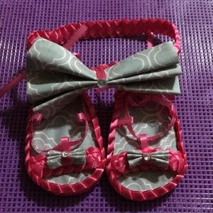New born shoes with matching headband.